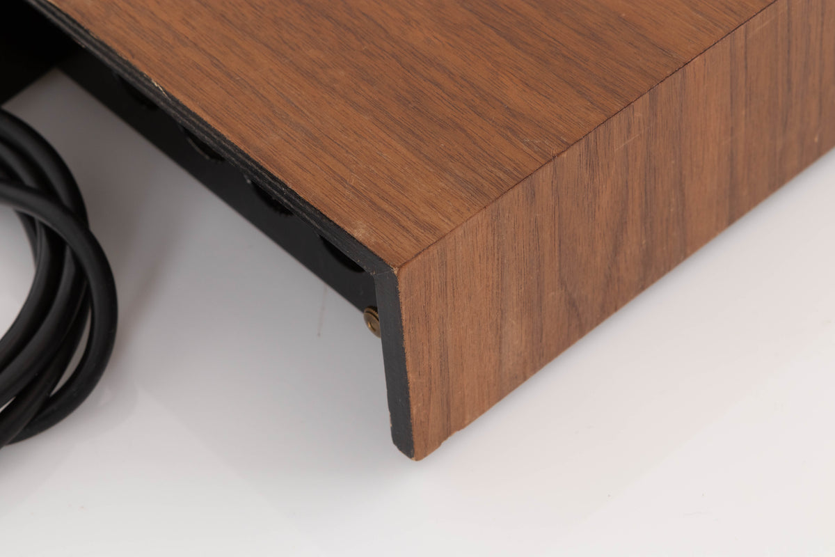 Rear left corner of a used A&R A60 Integrated Amplifier in a Teak finish