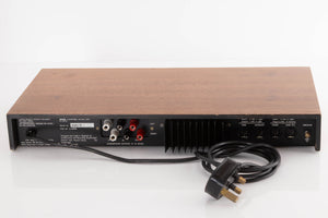 Rear view of a used A&R A60 Integrated Amplifier in a Teak finish showing Speaker Outputs and XLR Inputs