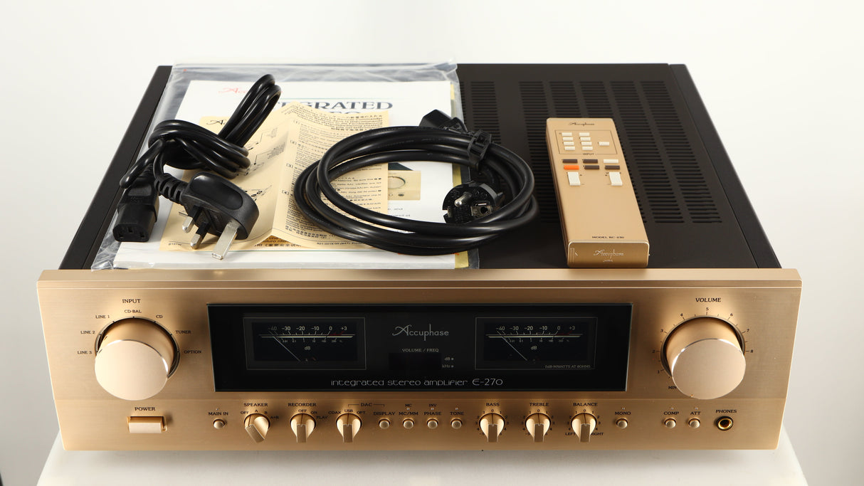 Top of a used Accuphase E270 Integrated Amplifier showing Remote, Manual, Mains Cable and Schuko Cable