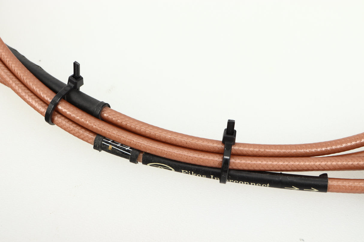 Close up of used Acoustic Precision Eikos Interconnect Cable 1.0m Pair showing logo