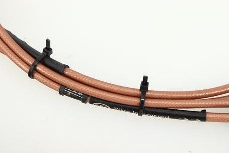 Close up of used Acoustic Precision Eikos Interconnect Cable 1.0m Pair showing logo