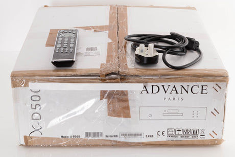 Box of a used Advance Paris X-D500 CD Transport with mains cable, manual, and remote