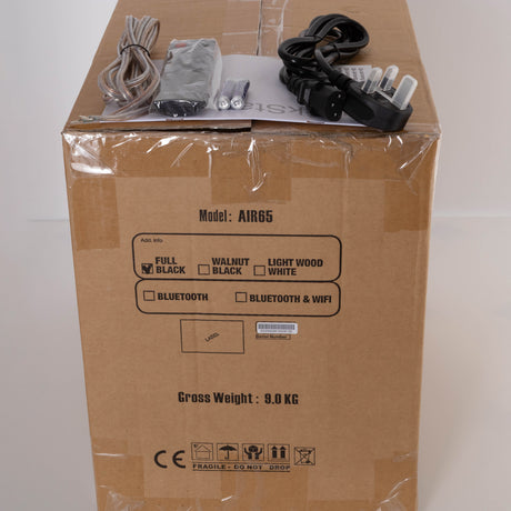 Box for a used Advanced Paris AIR 65 Wireless Speaker - Bluetooth Only in a Black finish showing Manual, Remote, Batteries and Mains Cable
