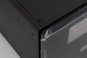 Close up of a used Advanced Paris X-i1100 Integrated Amplifier in a Black finish showing film peeling off