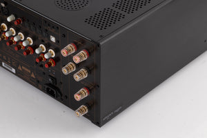 Rear left corner of a used Advanced Paris X-i1100 Integrated Amplifier in a Black finish