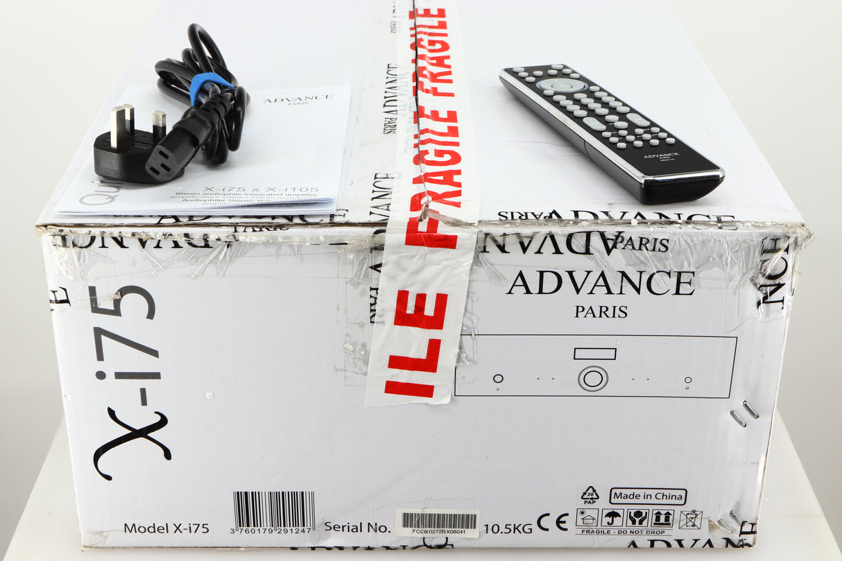Box for a used Advanced Paris X-i75 Integrated Amplifier in a black finish showing Remote, 2x Batteries, Manual and Mains Cable