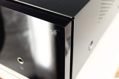 Close up of a used Advanced Paris X-i75 Integrated Amplifier in a black finish showing scratch on screen