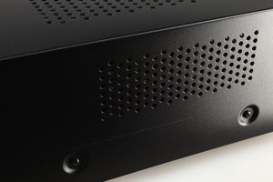 Close up of a used Advanced Paris X-i75 Integrated Amplifier in a black finish showing scratch on right side