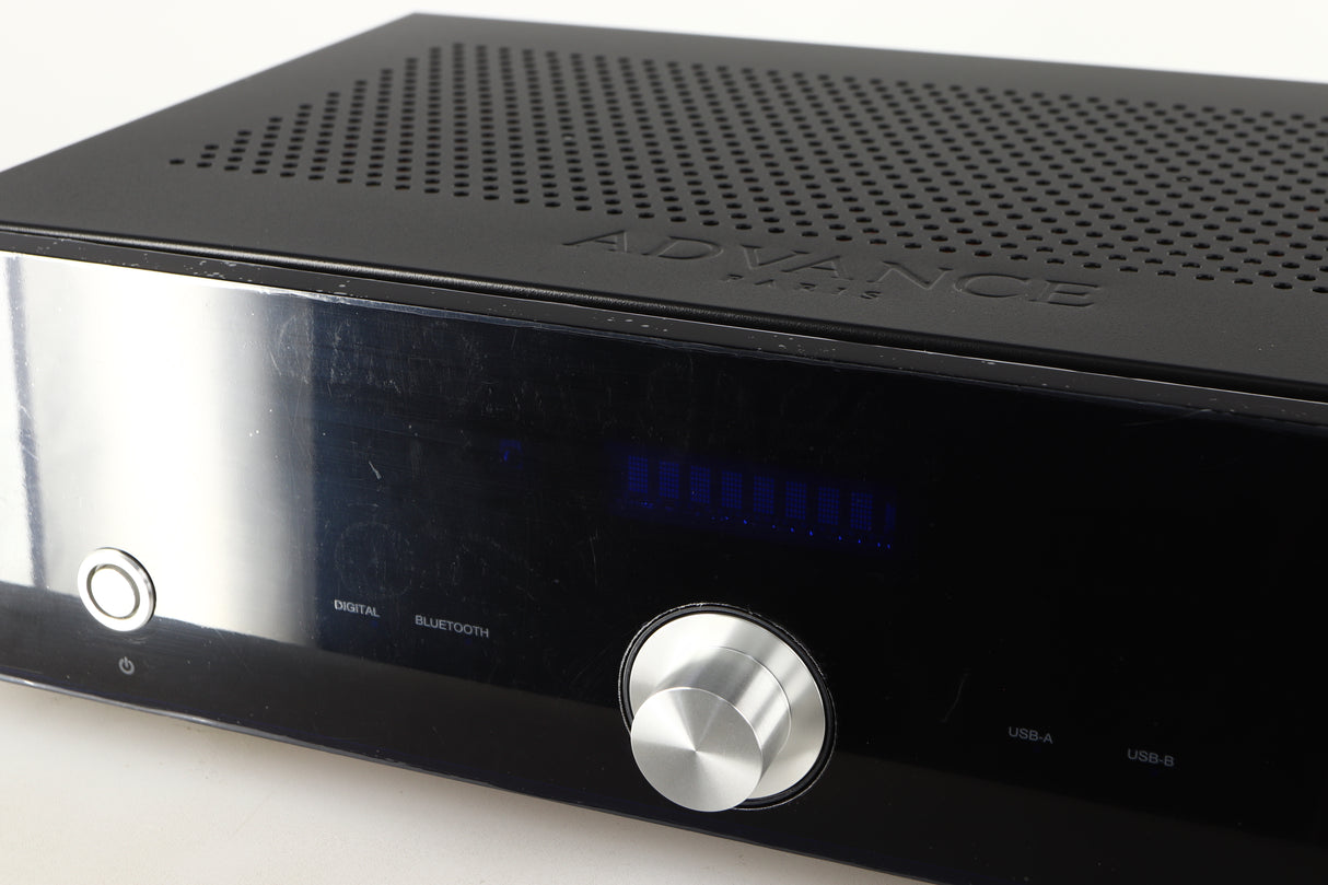 Close up of a used Advanced Paris X-i75 Integrated Amplifier in a black finish showing protective film on fascia