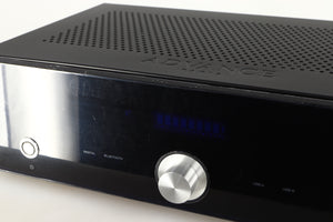 Close up of a used Advanced Paris X-i75 Integrated Amplifier in a black finish showing protective film on fascia