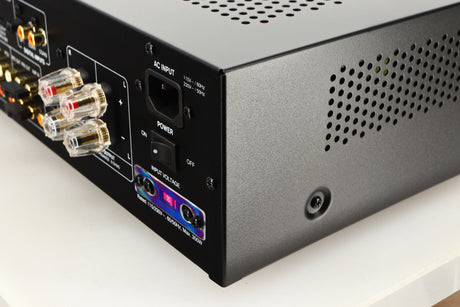 Rear left corner of a used Advanced Paris X-i75 Integrated Amplifier in a black finish