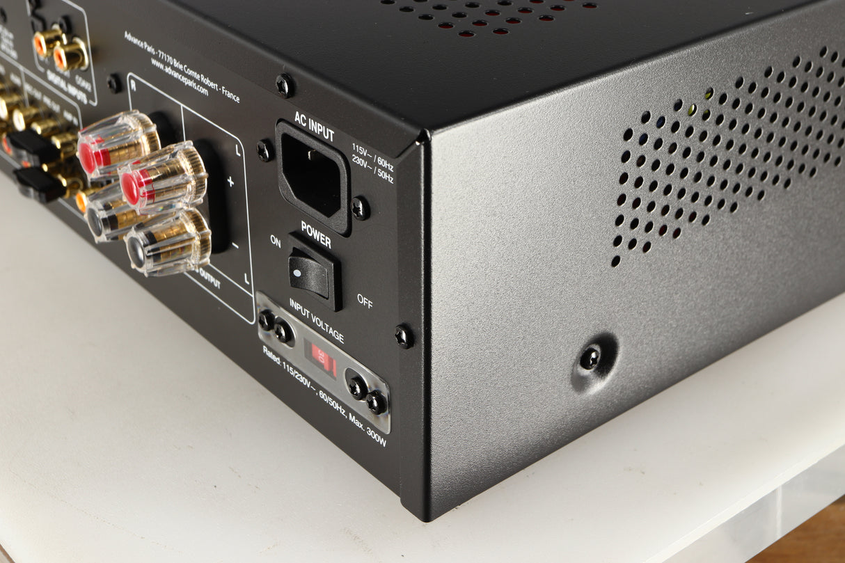 Rear left corner of a used Advanced Paris X-i75 Integrated Amplifier in a black finish