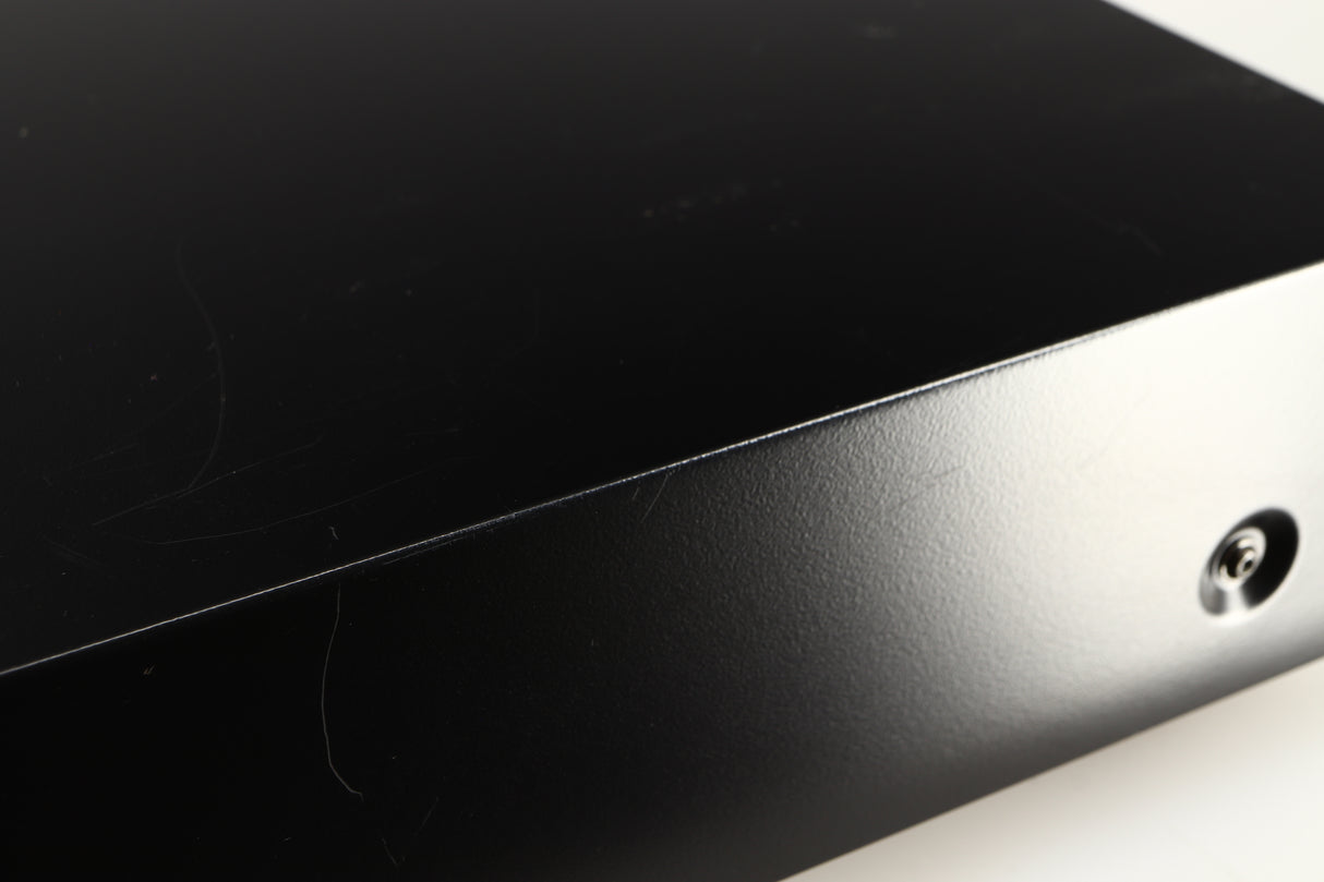 Close up of a used AH! Njoe Tjoeb 4000 CD Player in a black finish showing scratching around unit
