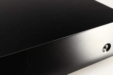 Close up of a used AH! Njoe Tjoeb 4000 CD Player in a black finish showing scratching around unit