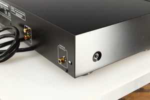 Rear left corner of a used AH! Njoe Tjoeb 4000 CD Player in a black finish