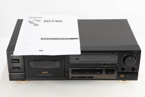 Front view of a used Aiwa AD-F460 Cassette Deck with manual