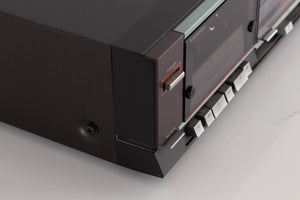 Front left corner of a used Aiwa F250 Cassette Deck