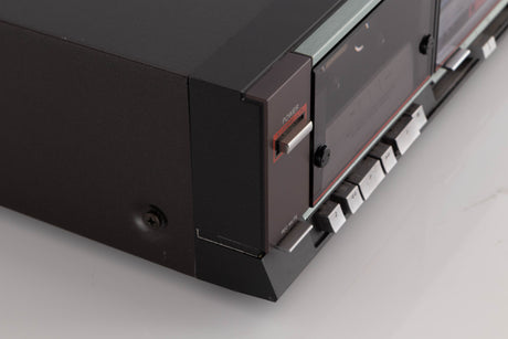 Front left corner of a used Aiwa F250 Cassette Deck