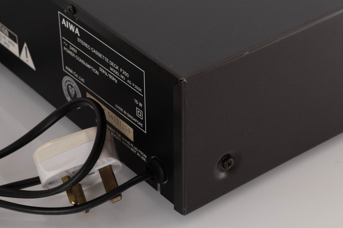 Rear left corner of a used Aiwa F250 Cassette Deck