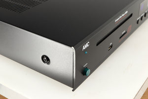 Front left corner of a used AMC XCDise-vt CD Player With MD5404us2 Tube Output in a black finish