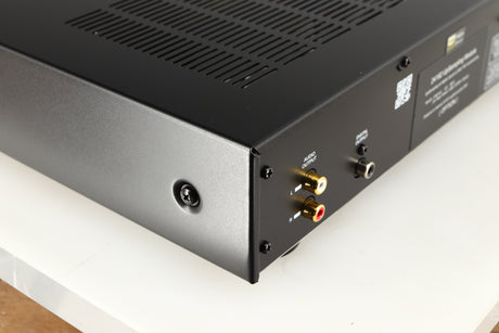 Rear right corner of a used AMC XCDise-vt CD Player With MD5404us2 Tube Output in a black finish
