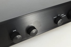 Close up view of an Ex Demo AMC XIA50 Integrated Amplifier fascia showing some discolouration near the treble knob