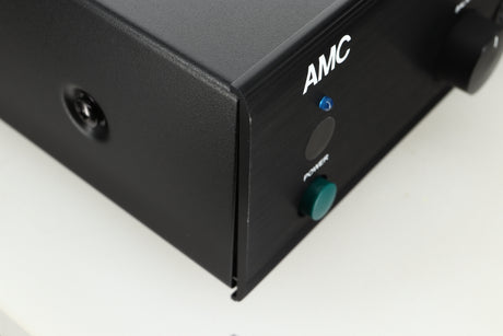 Close up view of an Ex Demo AMC XIA50 Integrated Amplifier front left corner showing some scratches