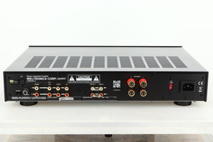 Rear view of an Ex Demo AMC XIA50 Integrated Amplifier showing RCA and mains inputs, and speaker outputs