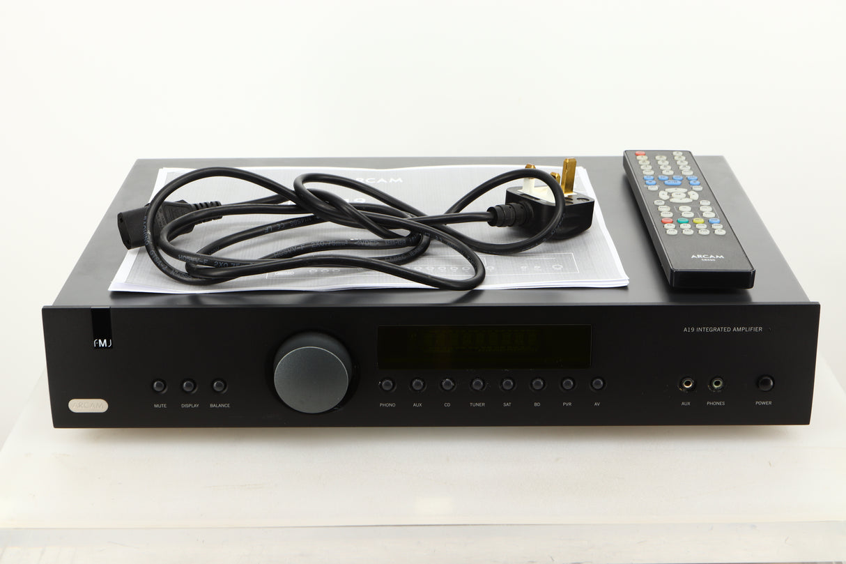 View of a used Arcam A19 Integrated Amplifier showing mains cable, and system remote 