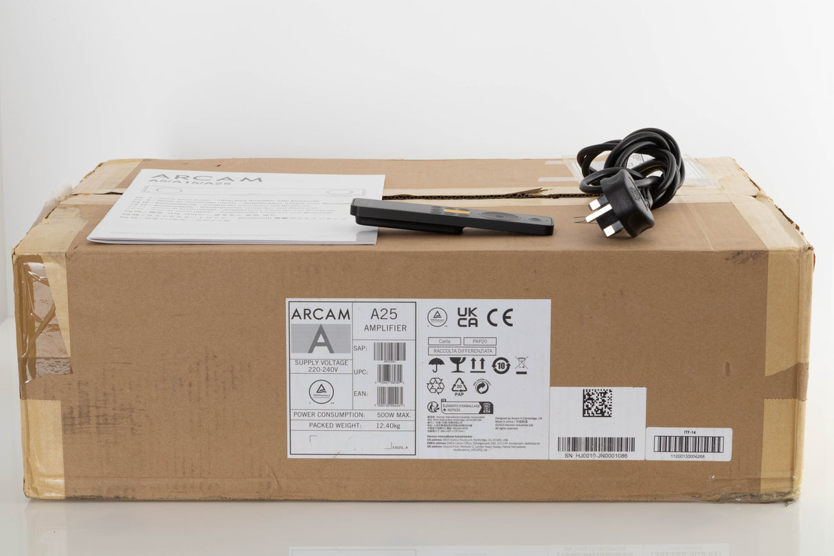 Box of a used Arcam A25 Radia Integrated Amplifier with mains cable, manual, and remote