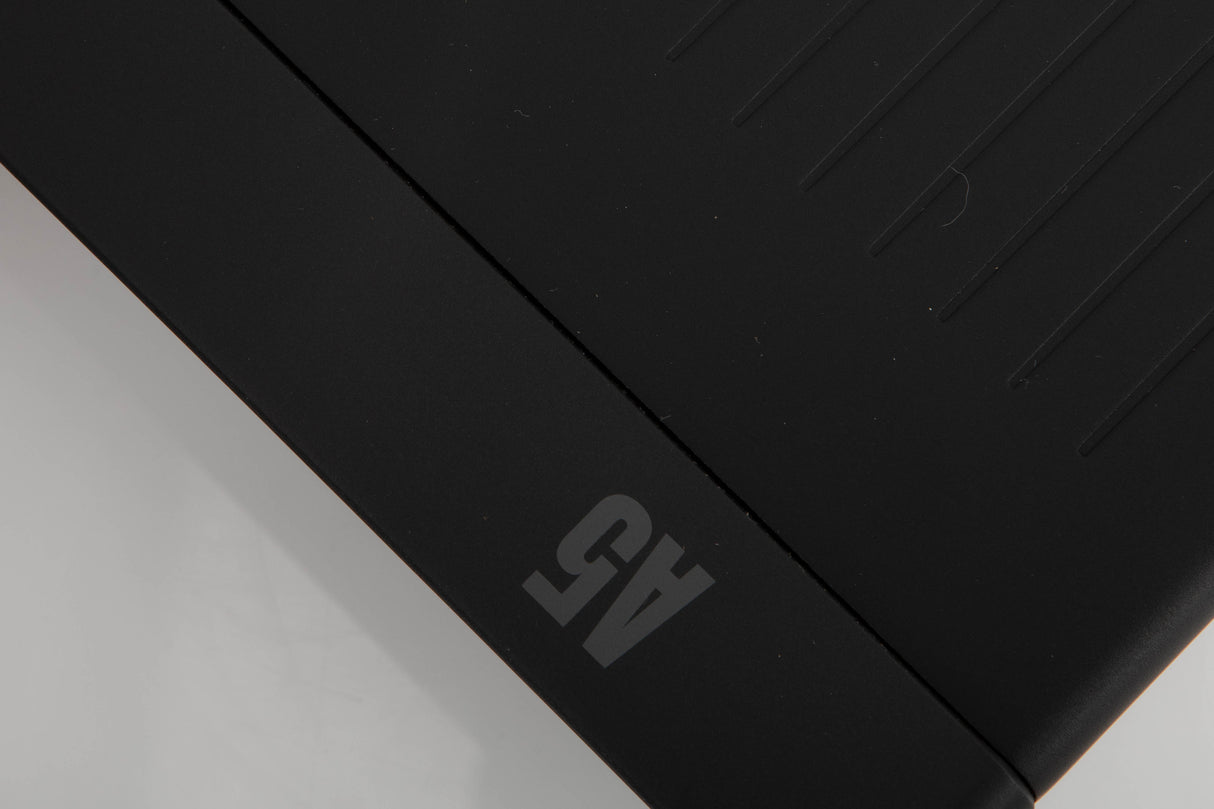 Close up of a used Arcam A5 Integrated Amplifier in a black finish showing light scratch on top