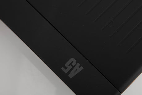 Close up of a used Arcam A5 Integrated Amplifier in a black finish showing light scratch on top