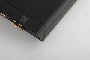 Rear left corner of a used Arcam A5 Integrated Amplifier in a black finish