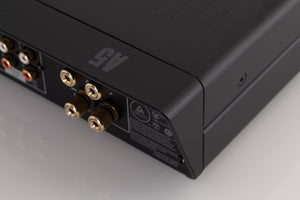 Rear left corner of a used Arcam A5 Integrated Amplifier in a Black finish