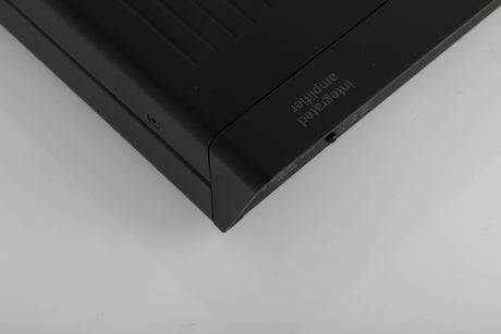 Rear right corner of a used Arcam A5 Integrated Amplifier in a black finish