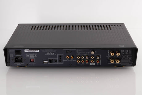 Rear view of a used Arcam A5 Integrated Amplifier in a Black finish showing Mains Input, USB Input, Digital Inputs, Optical Input, Network Input, Analogue Inputs, Phono Inputs and Pre Outputs