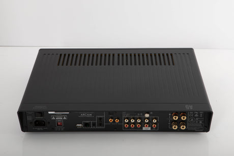 Rear view of a used Arcam A5 Integrated Amplifier in a black finish showing Phono Inputs, Phono Outputs, Mains Input, Network Input, USB Input, Optical Input and Speaker Outputs
