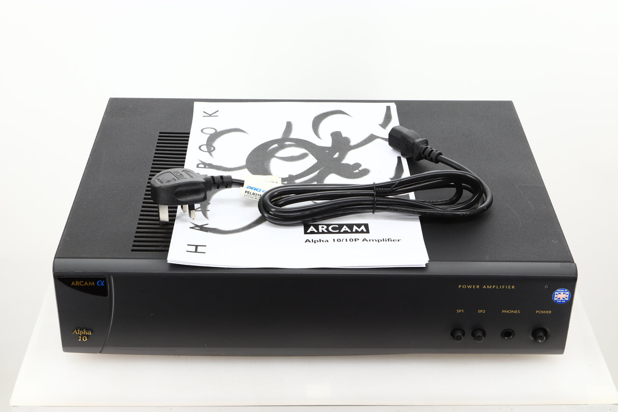 View of a used Arcam Alpha 10 Power Amplifier showing mains cable, and manual