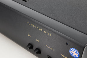 Close up view of a used Arcam Alpha 10 Power Amplifier showing scratching on the fascia and edge