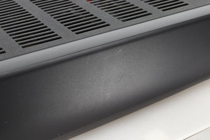 Close up view of a used Arcam Alpha 10 Power Amplifier showing scratching on the fascia