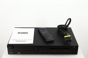 Top of a used Arcam Alpha 5 Plus CD Player in a black finish showing Manual, Remote and Mains Cable
