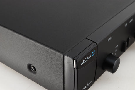 Close up of a used Arcam Alpha 5 Plus Integrated Amplifier in a black finish showing scratch on front left corner