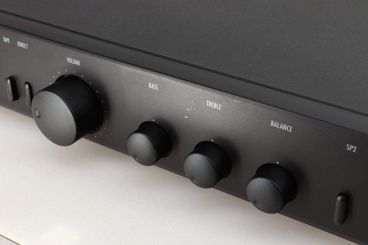 Close up of a used Arcam Alpha 5 Plus Integrated Amplifier in a black finish showing scratches on the fascia