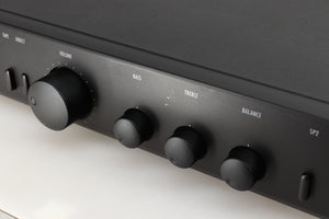 Close up of a used Arcam Alpha 5 Plus Integrated Amplifier in a black finish showing scratches on the fascia