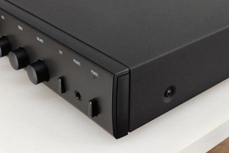 Front right corner of a used Arcam Alpha 5 Plus Integrated Amplifier in a black finish