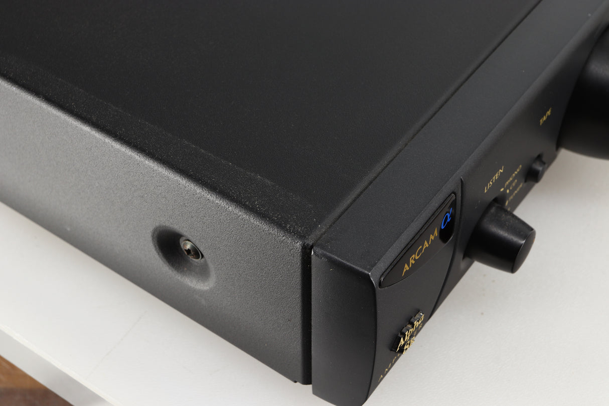Close up of a used Arcam Alpha 8R Integrated Amplifier in a black finish showing scratch on top