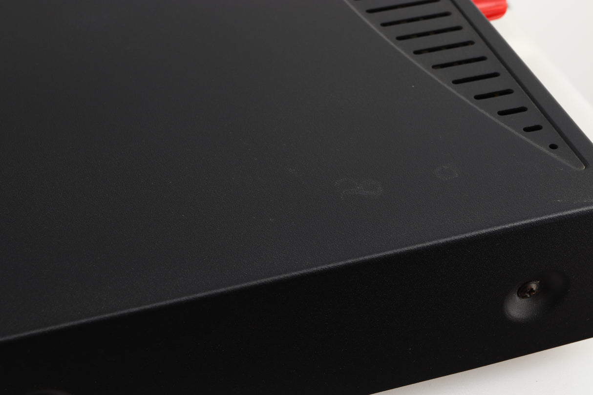 Close up of a used Arcam Alpha 8R Integrated Amplifier in a black finish showing marks on top