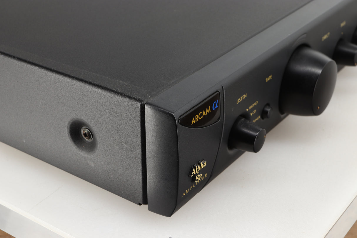 Front left corner of a used Arcam Alpha 8R Integrated Amplifier in a black finish