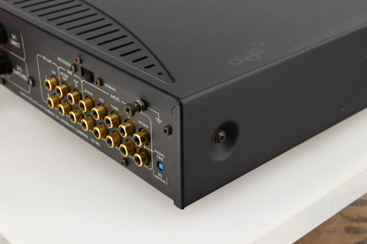 Rear left corner of a used Arcam Alpha 8R Integrated Amplifier in a black finish