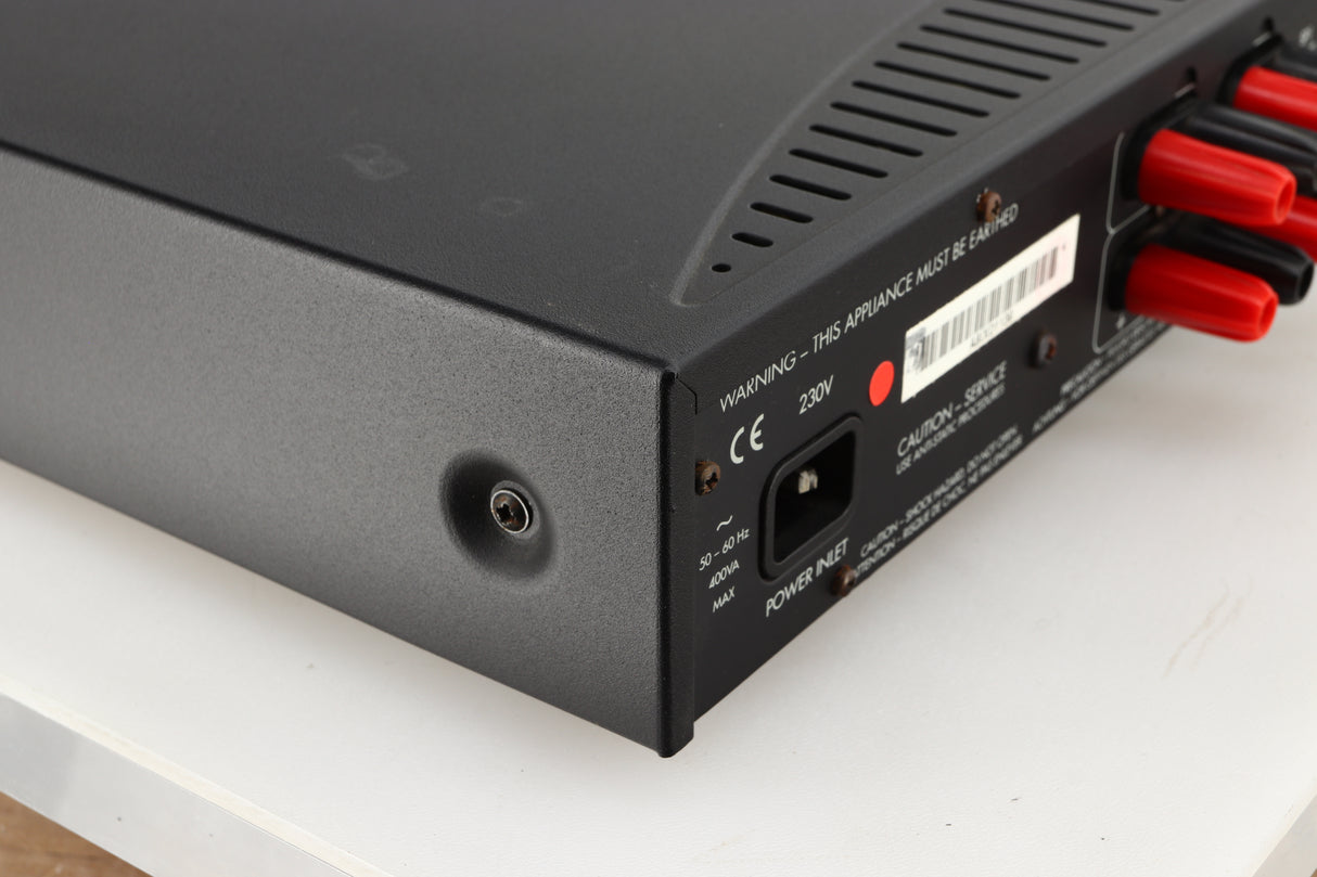 Rear right corner of a used Arcam Alpha 8R Integrated Amplifier in a black finish